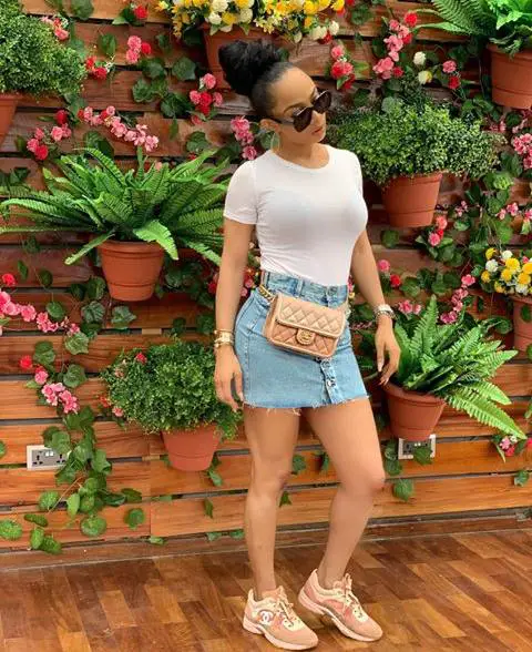 orange sneakers as styled by Toke Makinwa