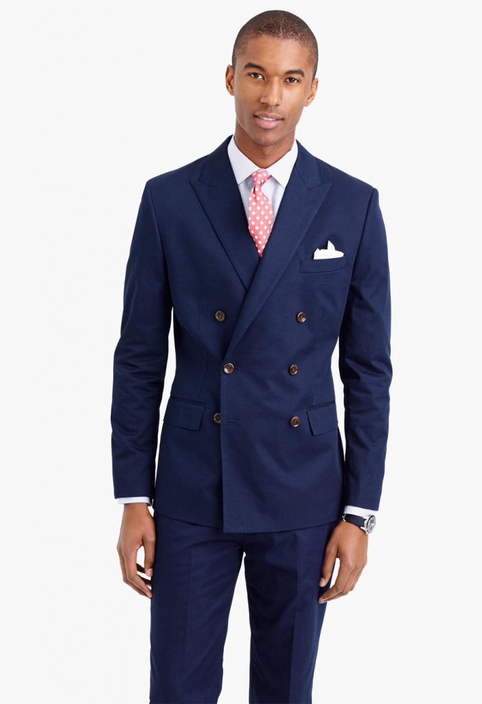 navy blue double breasted suit on a handsome black man